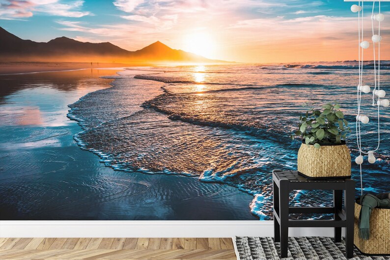Beach wall mural with dramatic sunset colors and serene ocean horizon
